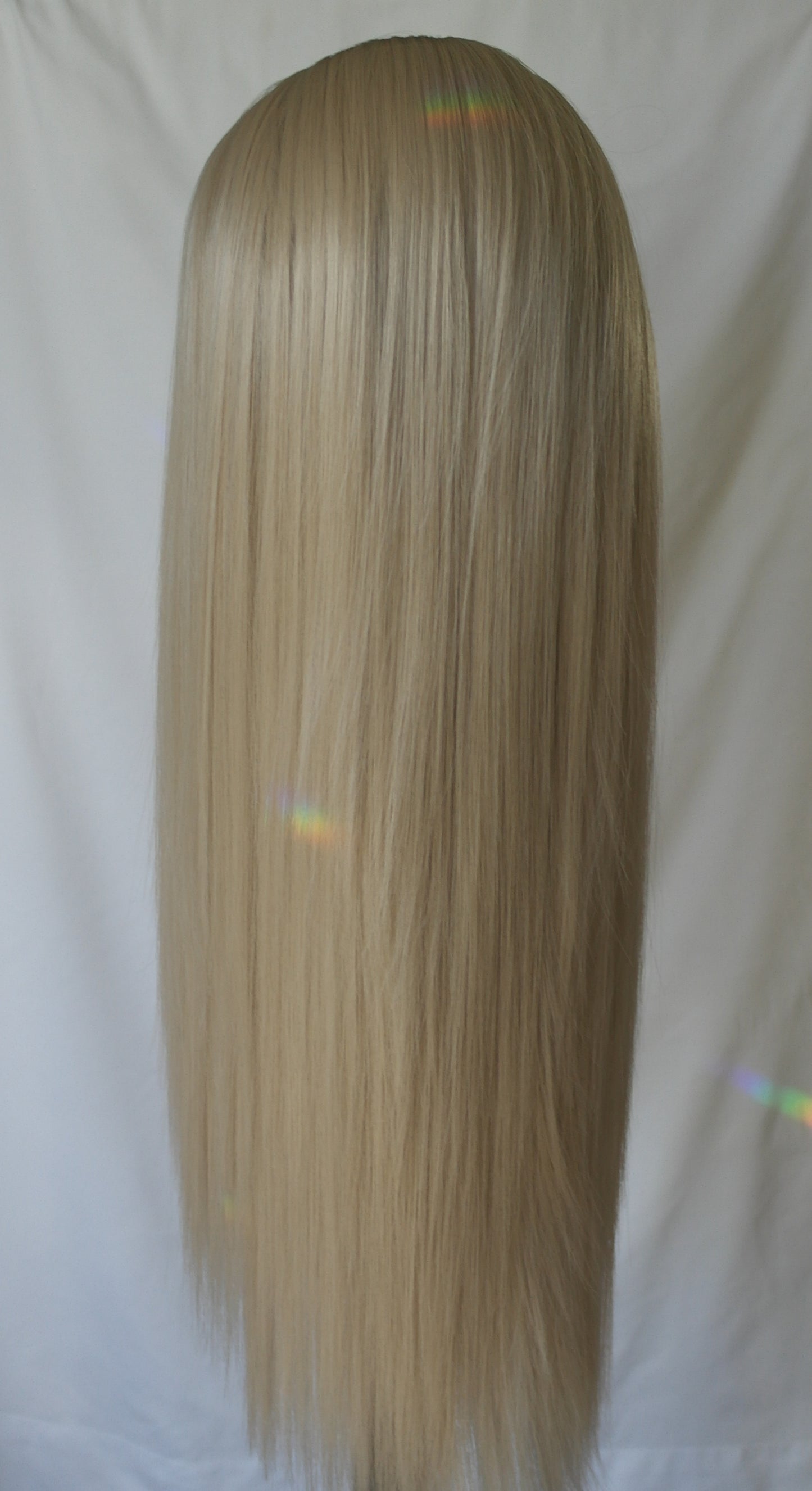 Luxurious creamy blonde wig with subtle beige undertones, reminiscent of a rich vanilla shade
