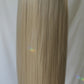 Luxurious creamy blonde wig with subtle beige undertones, reminiscent of a rich vanilla shade